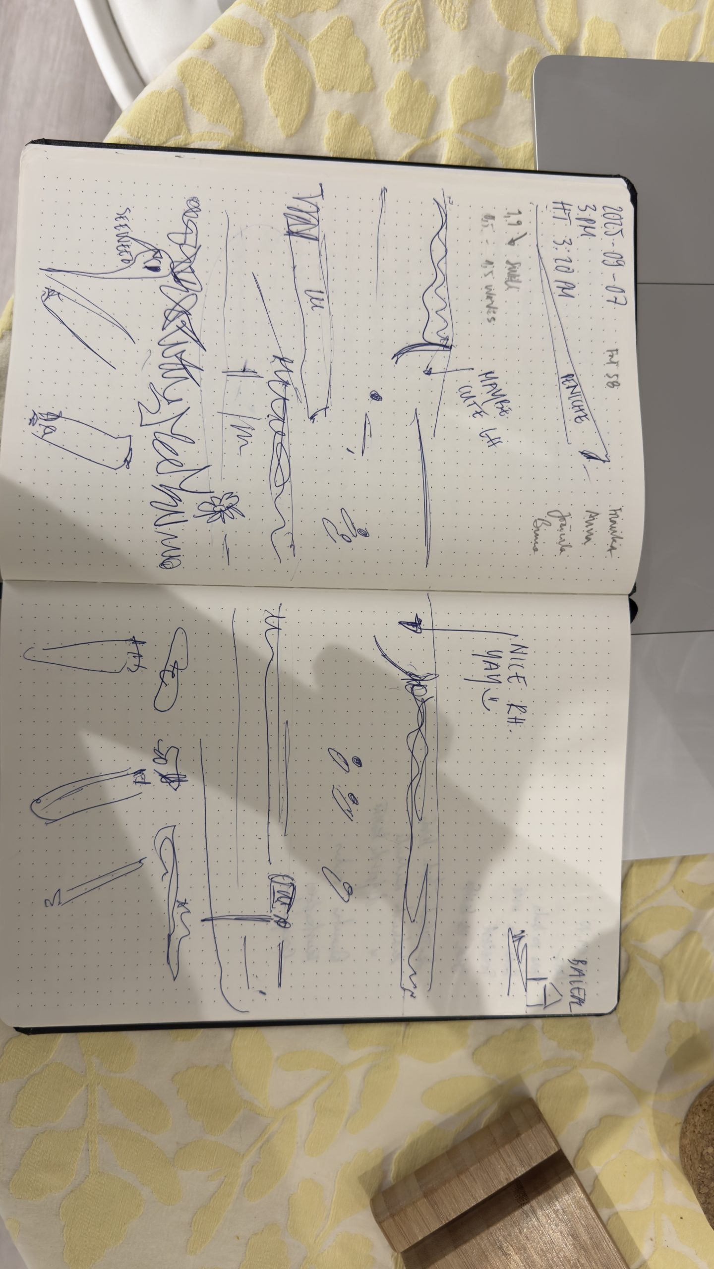 Real notebook with wave drawings, surfing lines and notes