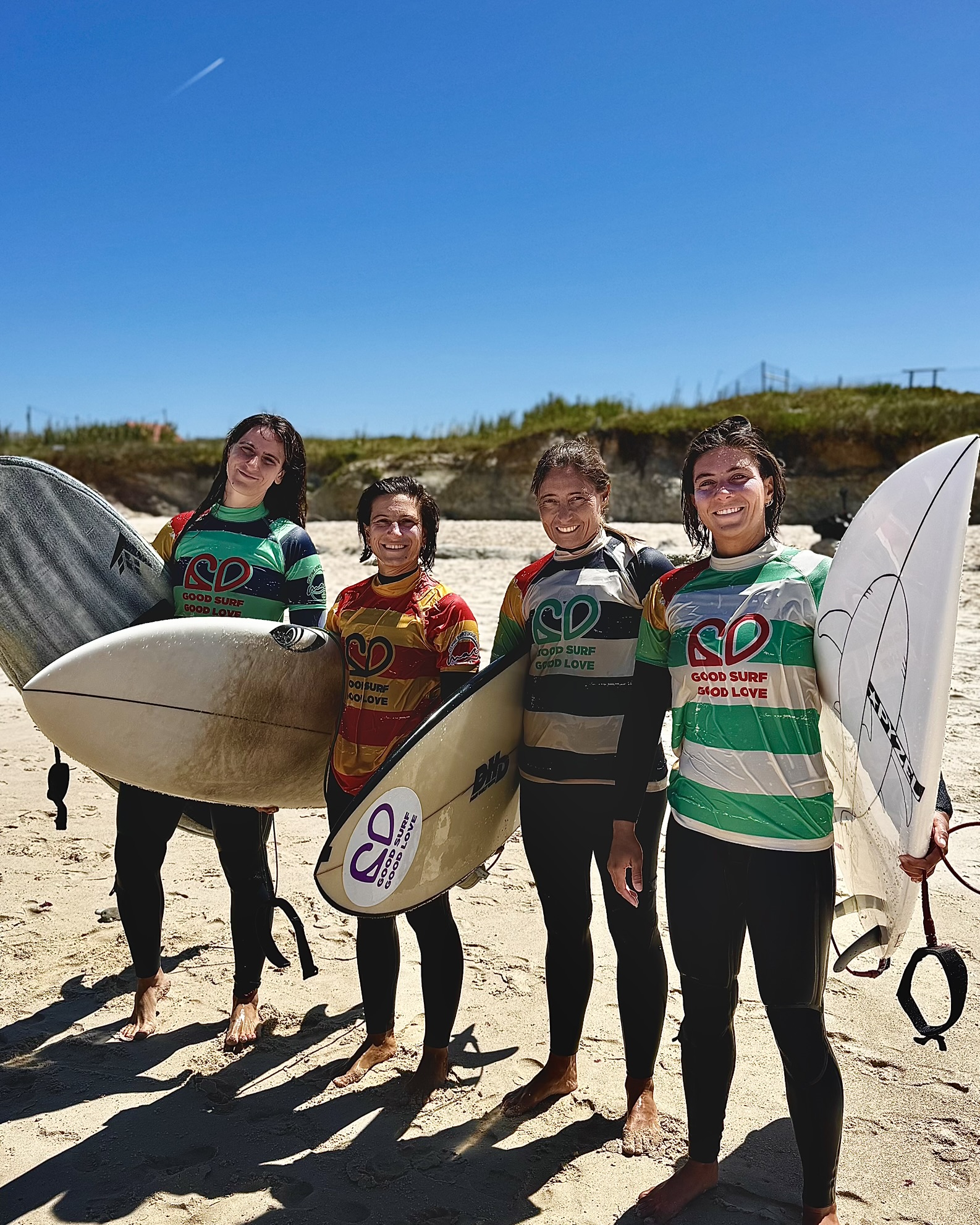 Surfers with boards on the beach, photograph supplied by Inês